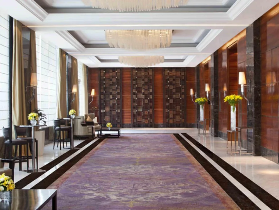 Sunlit pre-function area outside the ballroom at Holiday Inn Mayur Vihar