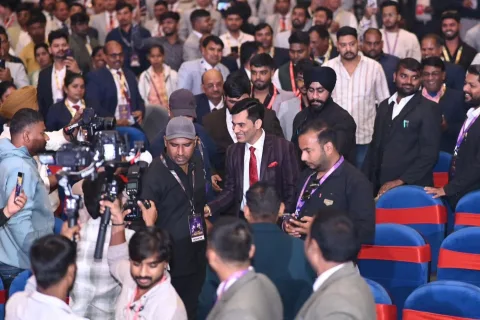 Attendees and media gathering at the summit